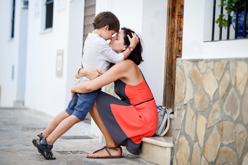 mother_hugging_kid_boy